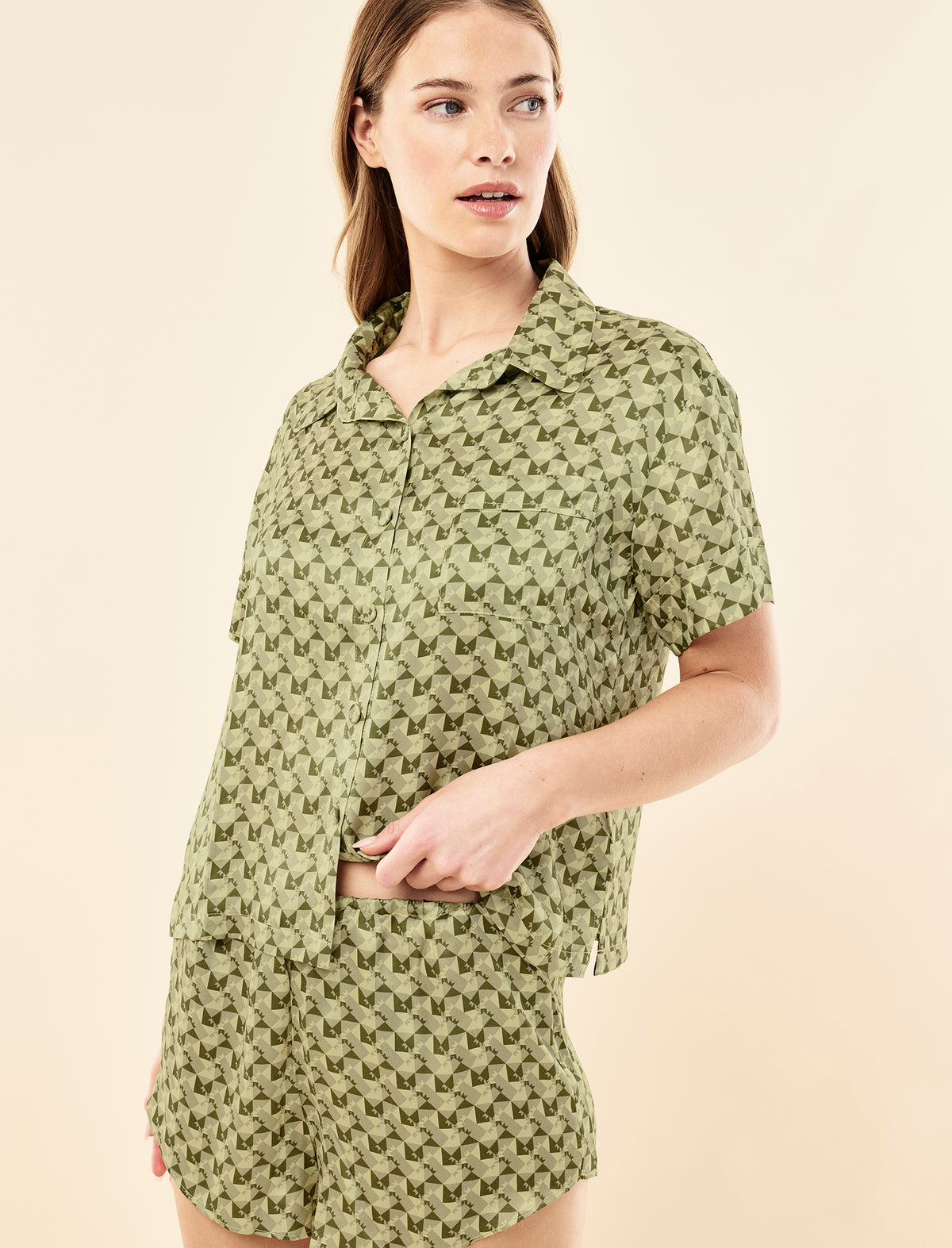 Sianie wearing the Karen Walker Monogram Tiles Silk Boxer PJ Set