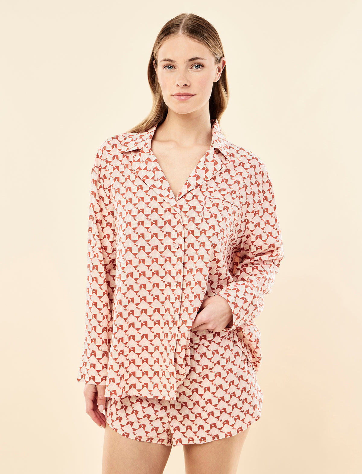 Sianie wearing the Karen Walker Monogram Tiles Long Sleeve Boxer PJ Set
[model: Sianie wears size S |  Height: 175m
/ 5’9” | Bust: 85cm | Waist: 66cm| Hips: 93cm]